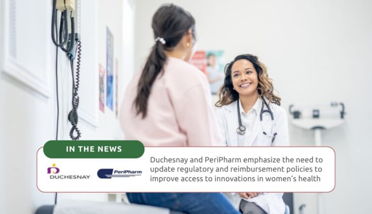 A female doctor smiling at her female patient