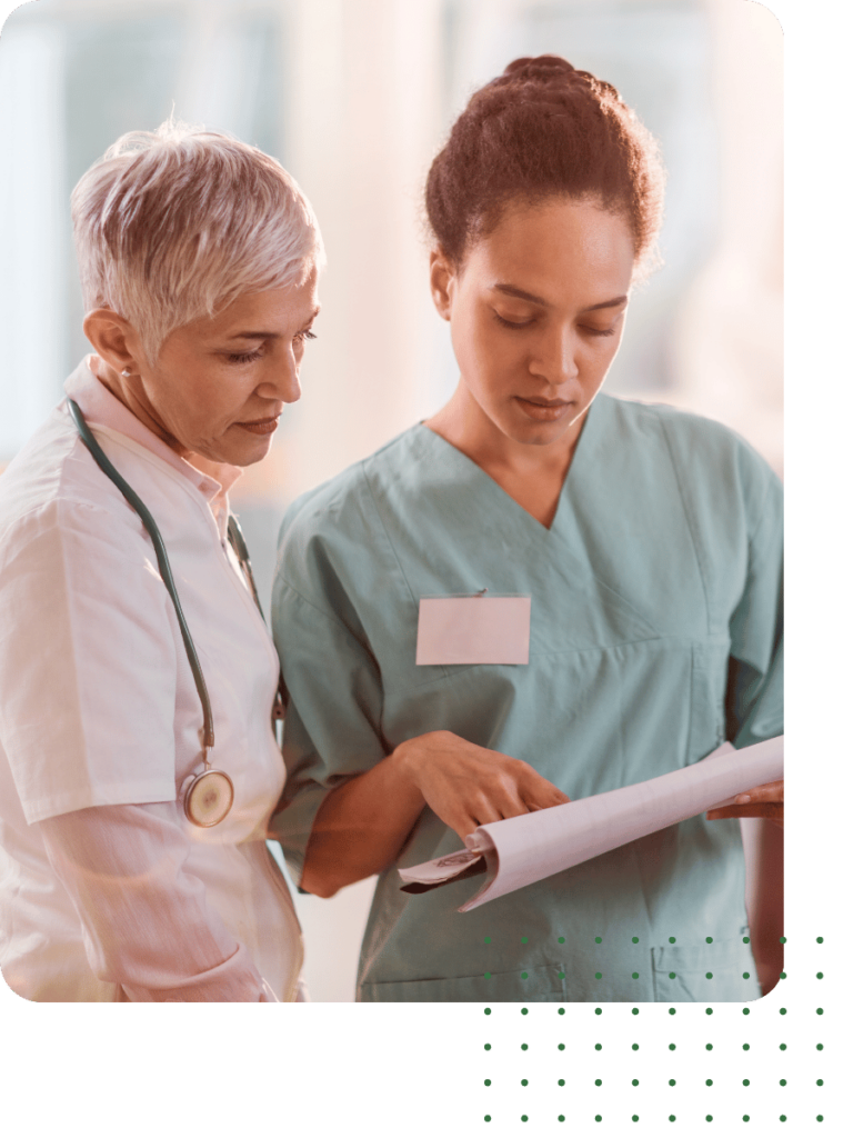 A nurse showing a doctor a patient chart